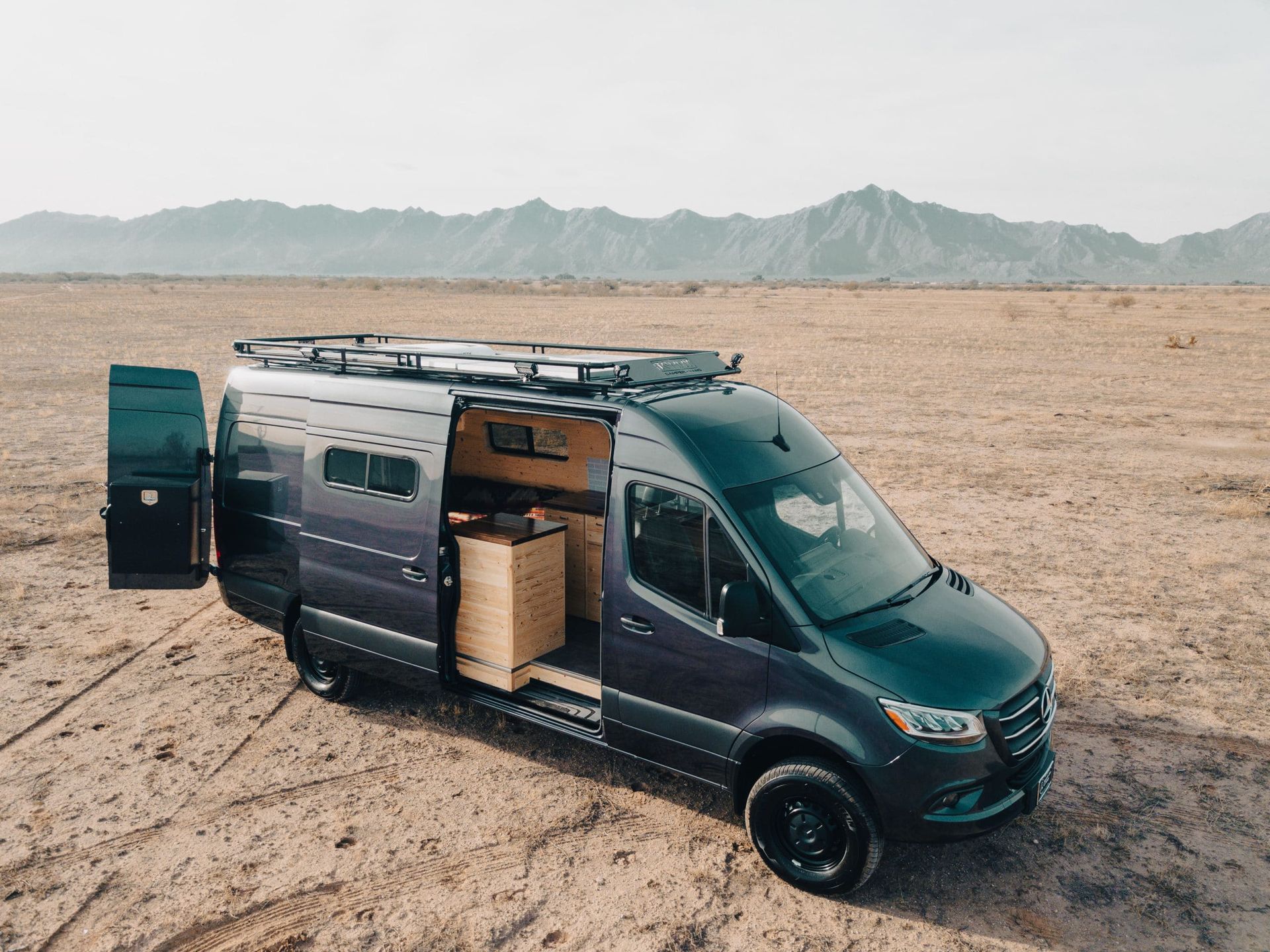 Custom camper built by R-Line Maatwerk in a desert landscape